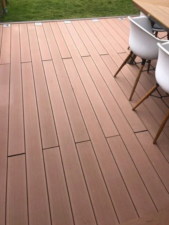 Composite decking close-up with outdoor dining furniture